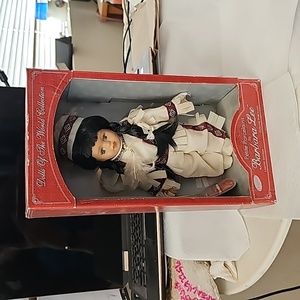 Petite porcelain doll native american